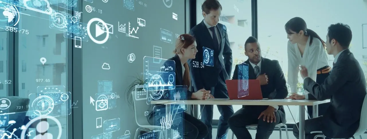 A team of IT professionals collaborating on a software development project through an IT staff augmentation model.